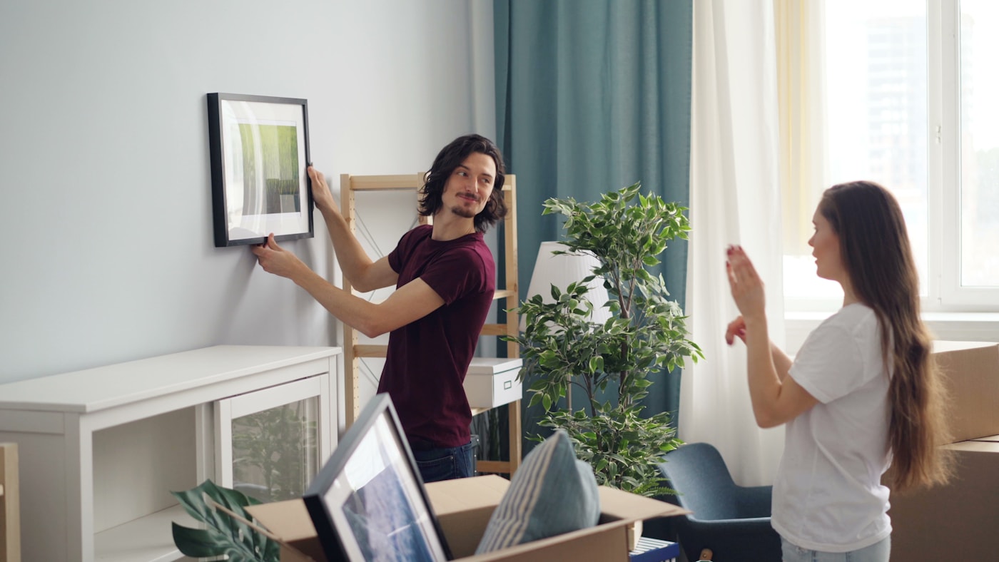 A happy couple settling into their new Bay Area home after a move